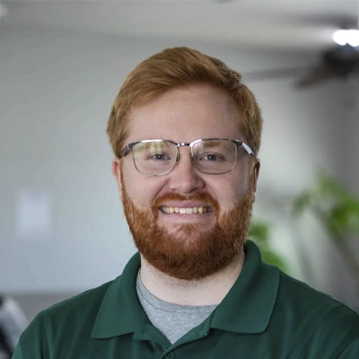 A headshot of Dr. Reilly Enos, a chiropractor at Eaton Chiropractic.